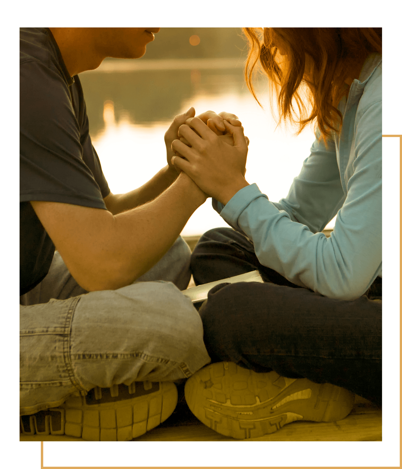 Couple sitting holding hands